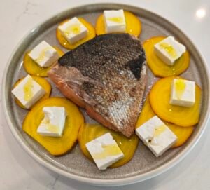 Salmon plate with sliced beet and cheese