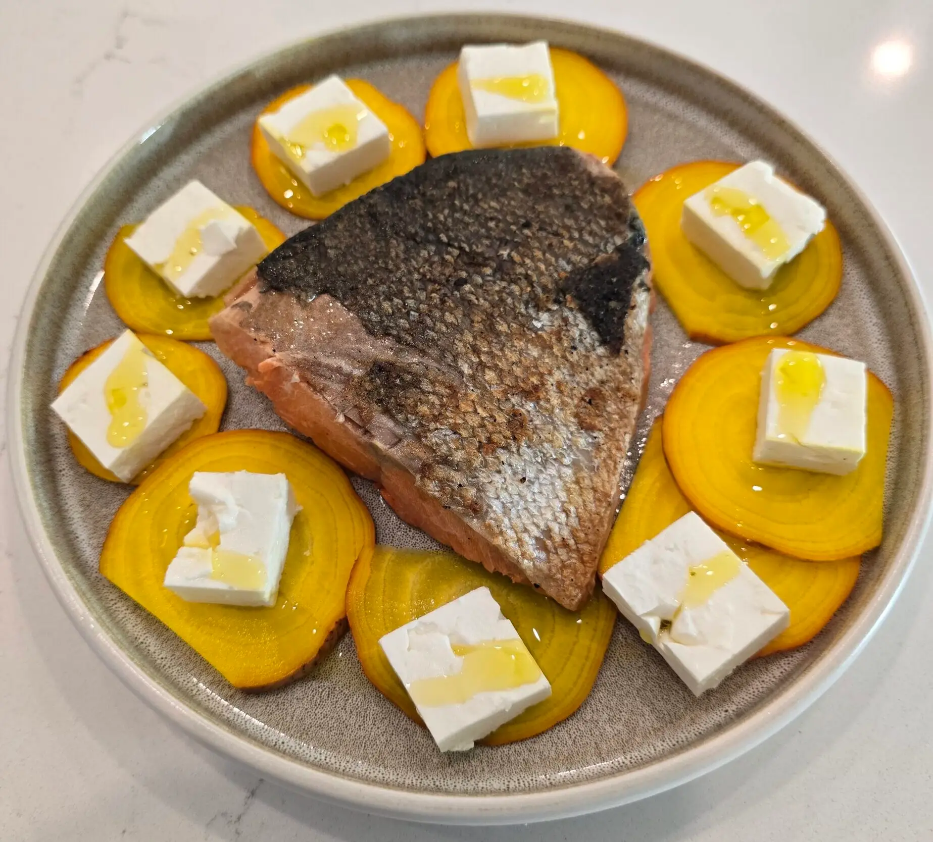 Salmon plate with sliced beet and cheese