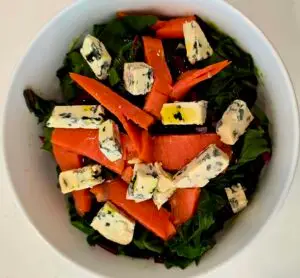 Beet leaf salad with salmon and goat cheese