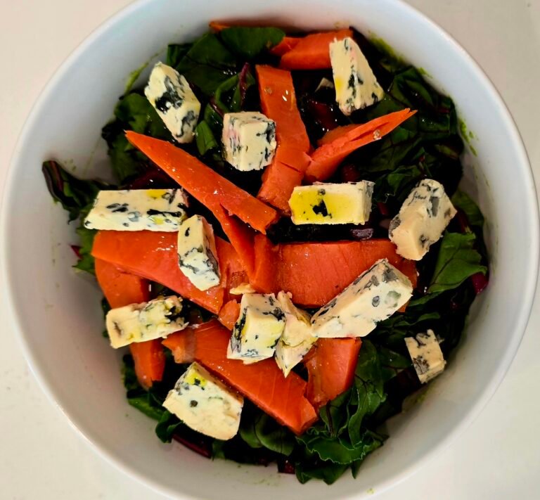 Beet leaf salad with salmon and goat cheese